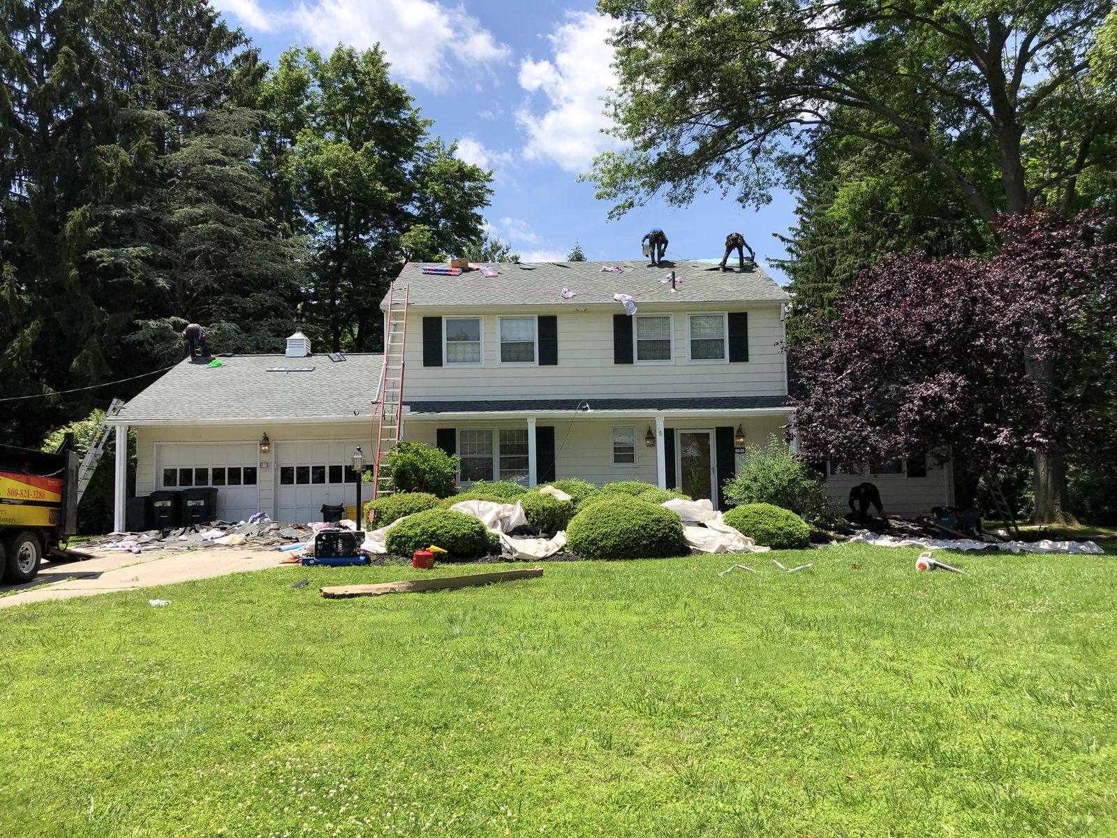 Roofers at work on a coastal home roof